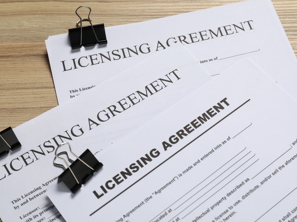 Broughan Blog Posts (4) A stack of licensing agreements.